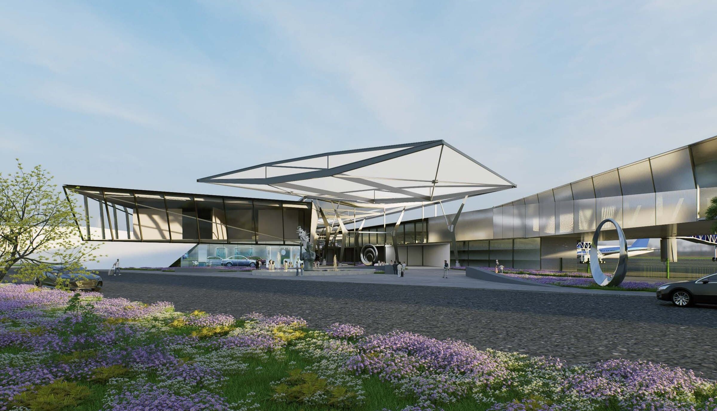 Exterior rendering of the Ibizannale terminal building by day, a sweeping cantilevered roof over the entrance approach with purple flowering shrubs in the foreground.