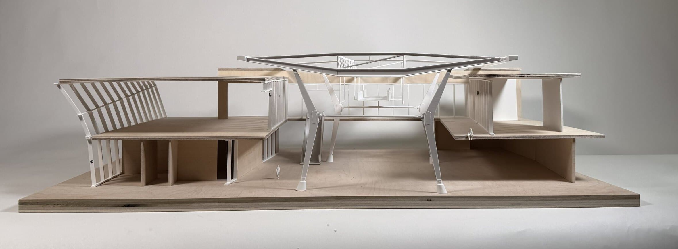 Photograph of a sectional chunk model of the terminal, a folded roof plane supported on angled columns above stepped floor plates.